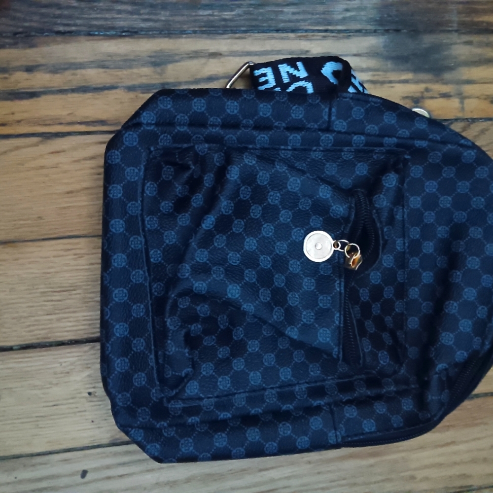 Blue bag with white logo on strap